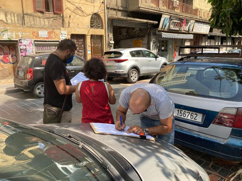 DGA staff recording damaged buildings on Gouraud Street, Medawar (photo courtesy of the DGA)