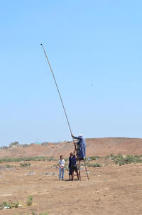 Figs. 11, 12: Using a 12m long metal pole to record archaeological features (courtesy of Italian mission in Beheira) Figs. 11, 12: Using a 12m long metal pole to record archaeological features (courtesy of Italian mission in Beheira)